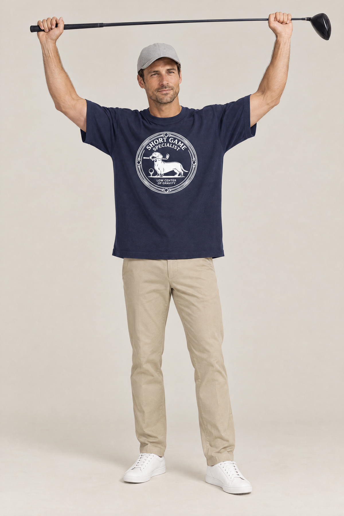Man stretching with a driver above his head in the navy Short Game Specialist Dachshund Golf Tee. Color: Navy