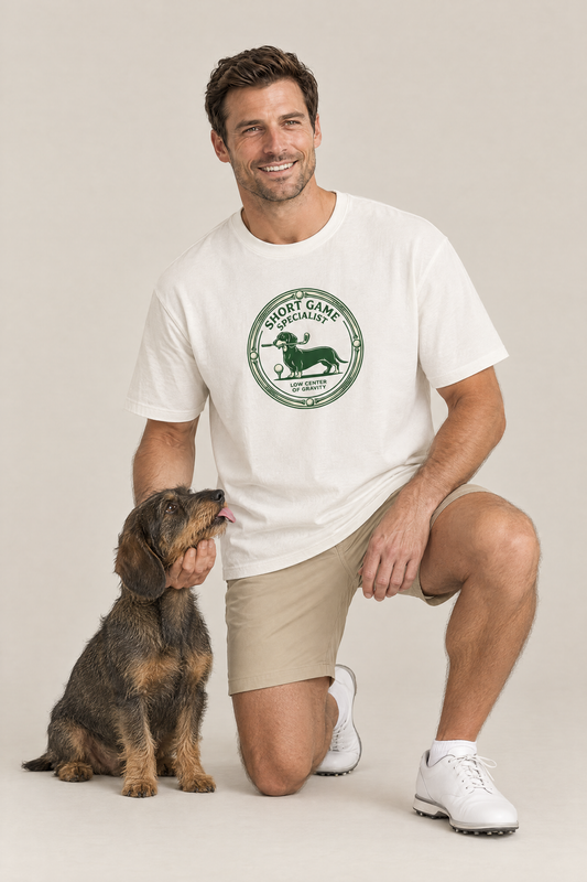 Man kneeling with a wire-haired dachshund in the white Short Game Specialist Dachshund Golf Tee. Color: White