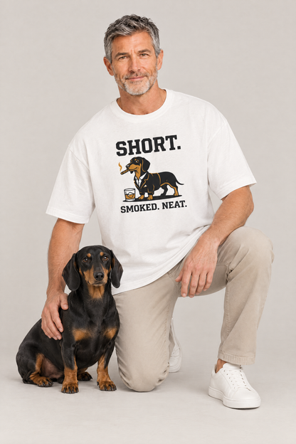 Man kneeling next to a black and tan dachshund in the white Short Smoked Neat Dachshund Tee. Color: White