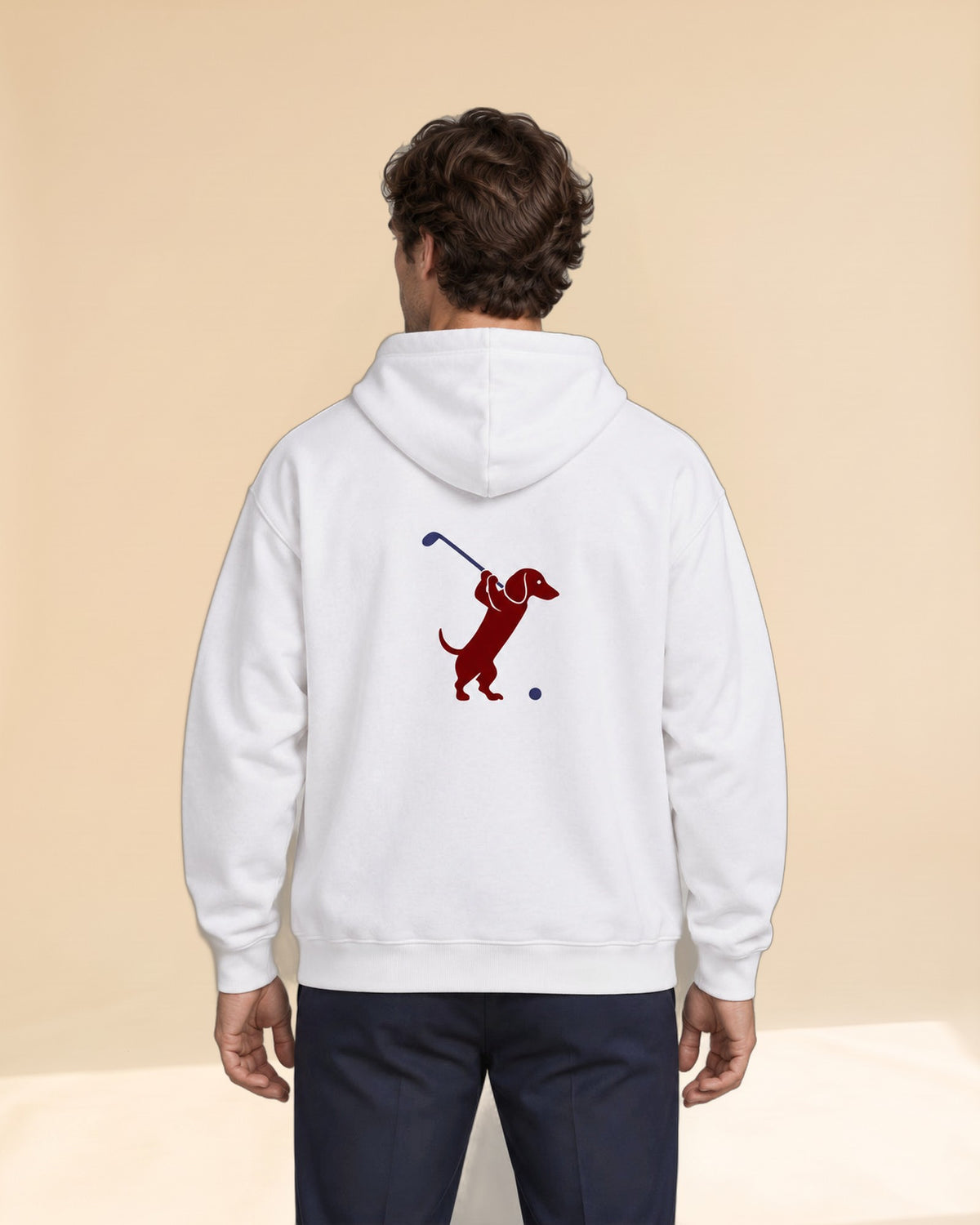 Man wearing Club & Swing dachshund golf hoodie, back studio view. Color: White