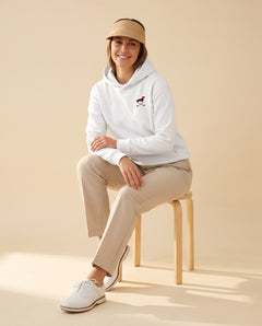 Woman wearing Club & Swing dachshund golf hoodie, full-body studio look. Color: White