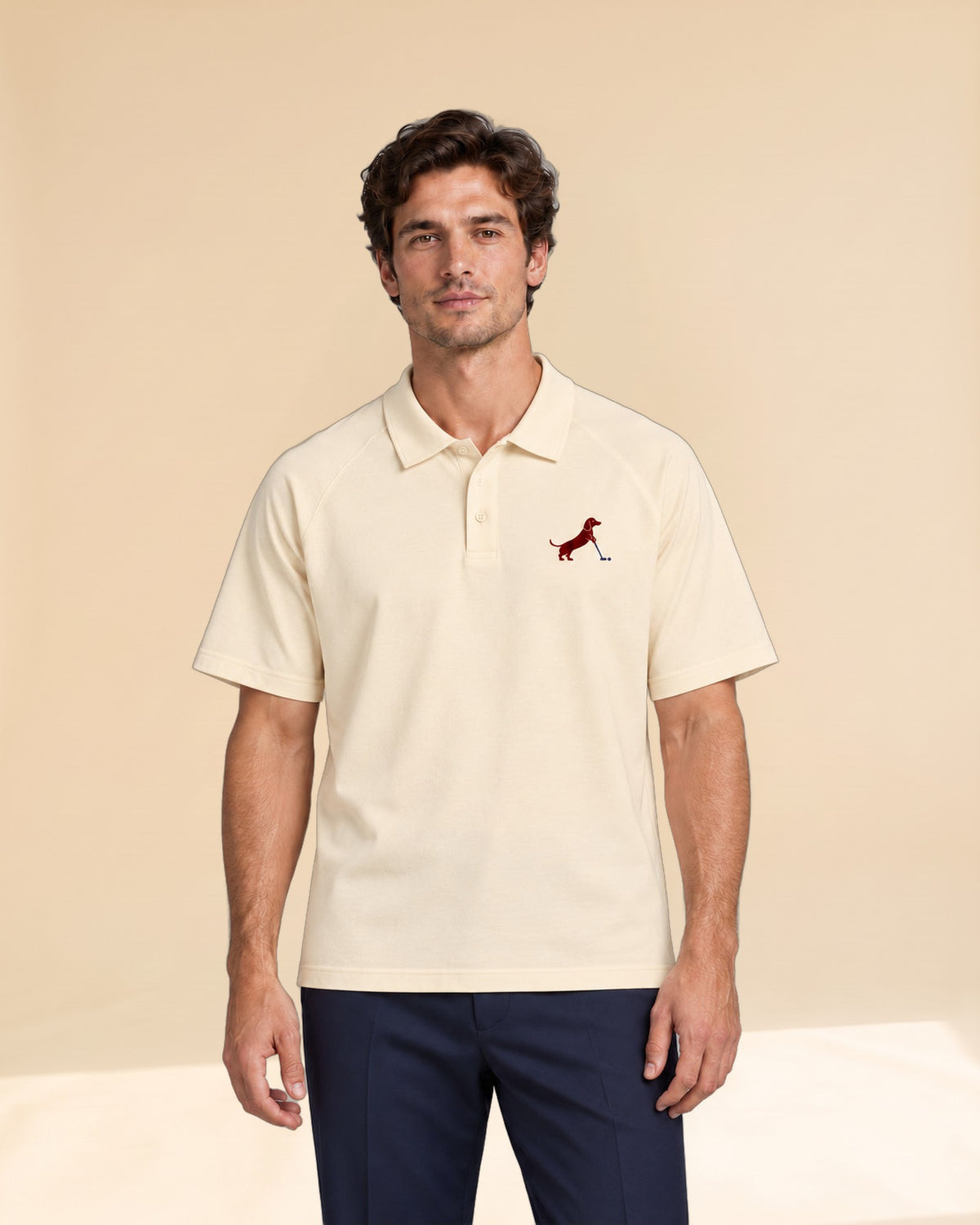Man wearing Putting dachshund golf polo, front studio view. Color: Apricot