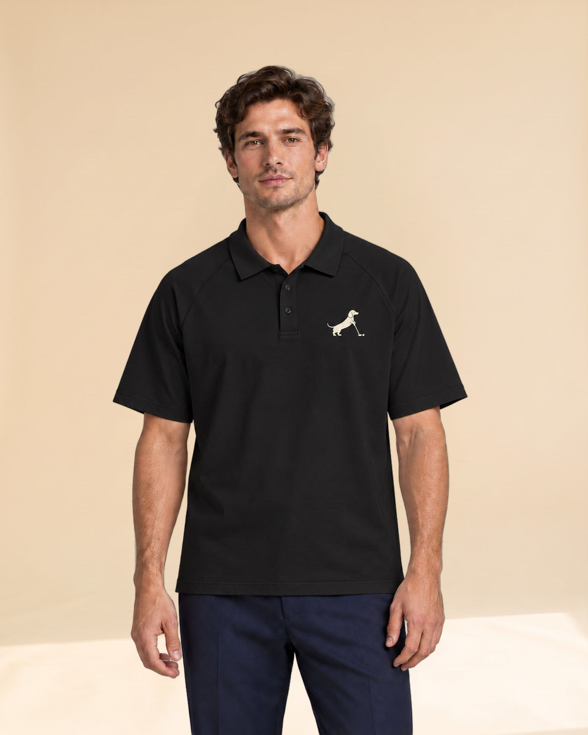 Man wearing Putting dachshund golf polo, front studio view. Color: Black