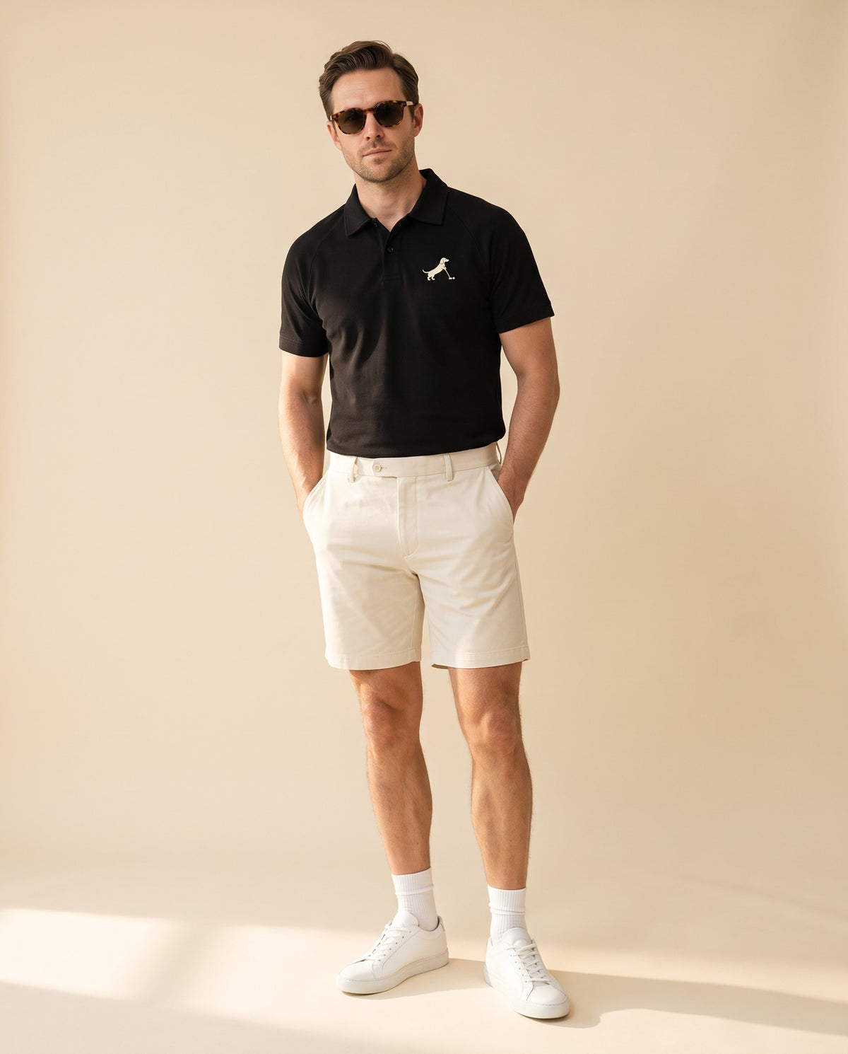 Man wearing Putting dachshund golf polo, full-body studio look. Color: Black