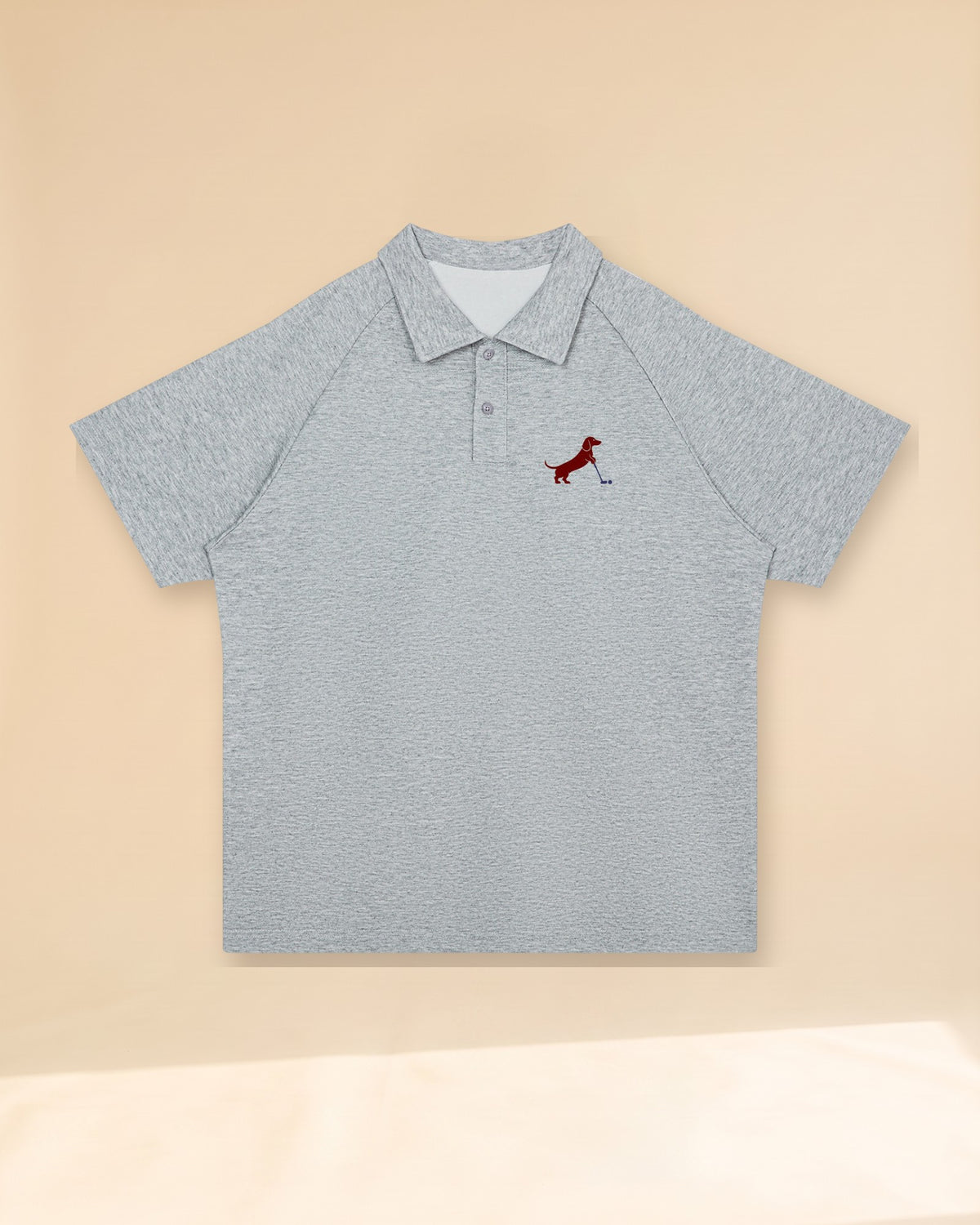 Putting dachshund golf polo, front flatlay. Color: Flower Gray
