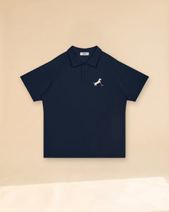 Putting dachshund golf polo, front flatlay. Color: Navy Blue