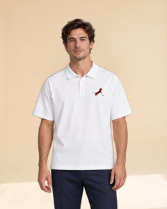 Man wearing Putting dachshund golf polo, front studio view. Color: White