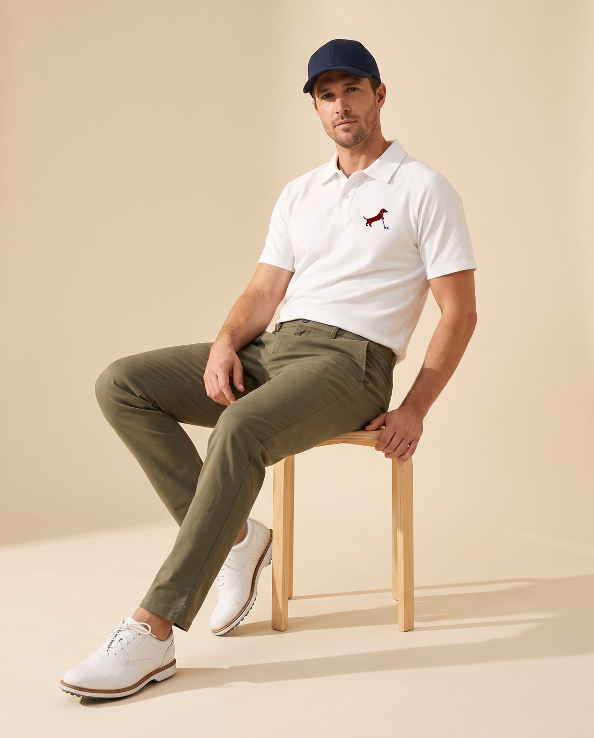 Man wearing Putting dachshund golf polo, full-body studio look. Color: White