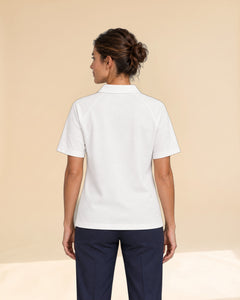 Woman wearing Putting dachshund golf polo, back studio view. Color: White