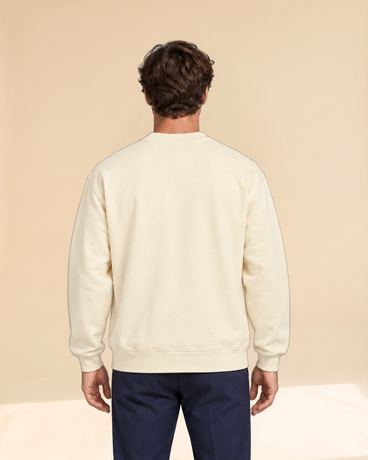 Man wearing Swing dachshund golf sweatshirt, back studio view. Color: Apricot