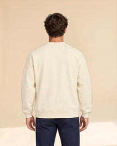 Man wearing Swing dachshund golf sweatshirt, back studio view. Color: Apricot
