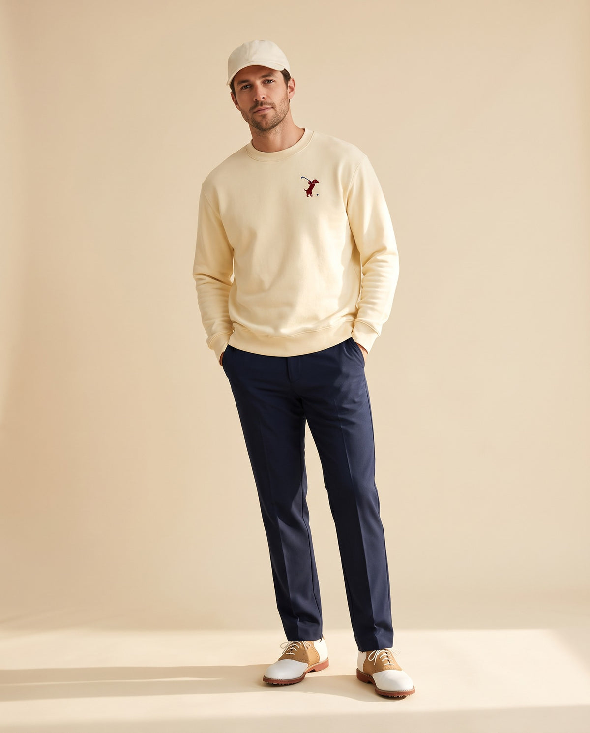 Man wearing Swing dachshund golf sweatshirt, full-body studio look. Color: Apricot