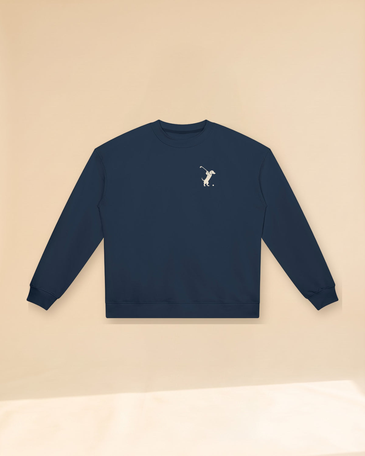 Swing dachshund golf sweatshirt, front flatlay. Color: Navy