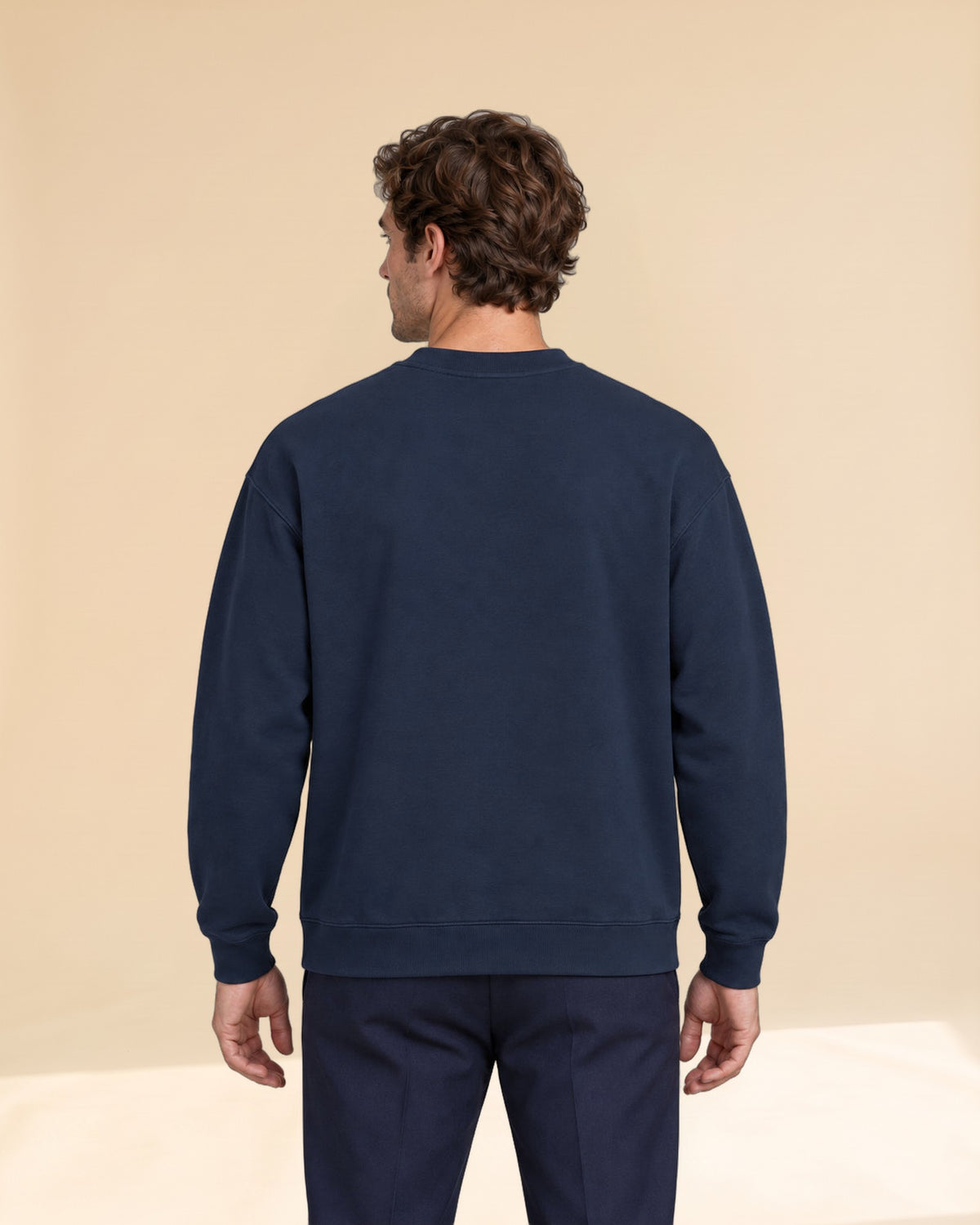 Man wearing Swing dachshund golf sweatshirt, back studio view. Color: Navy