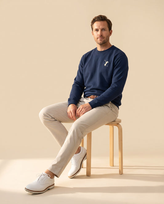 Man wearing Swing dachshund golf sweatshirt, full-body studio look. Color: Navy