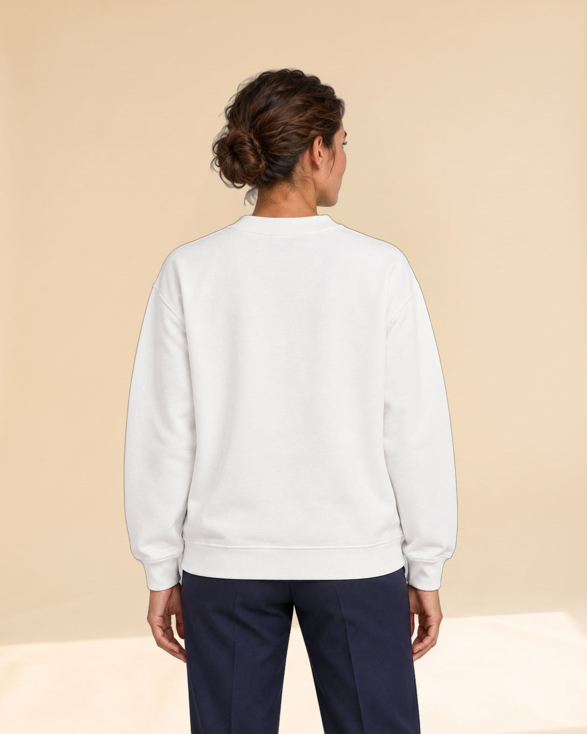 Woman wearing Swing dachshund golf sweatshirt, back studio view. Color: White