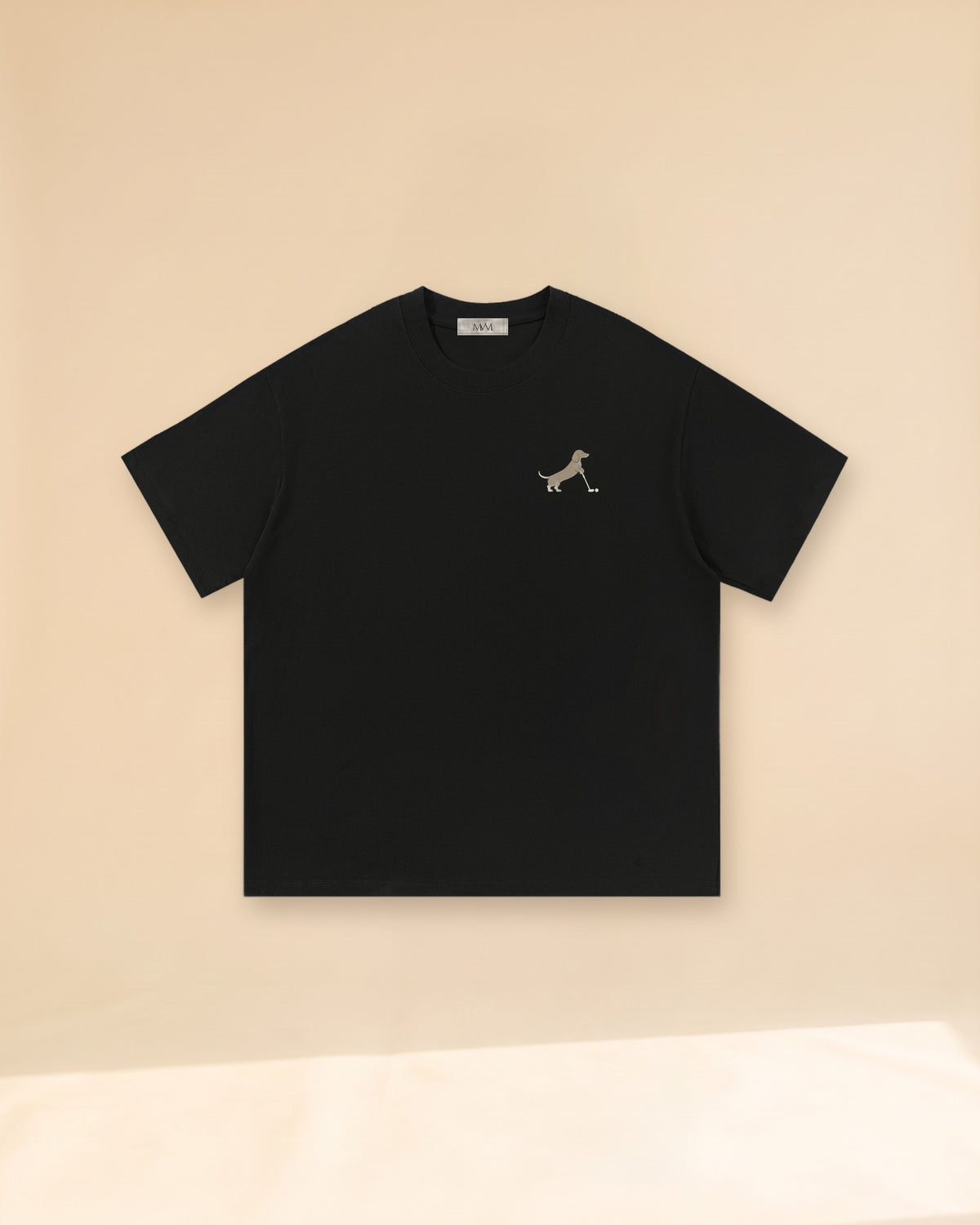 Putting dachshund golf T-shirt, front view. Color: Black