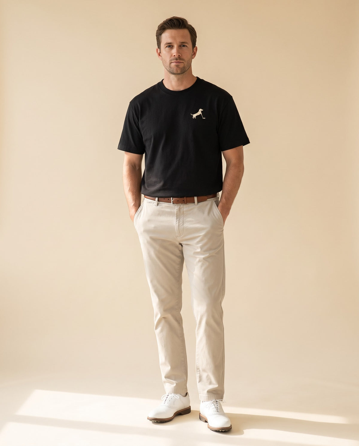Man wearing Putting dachshund golf T-shirt, full-body studio look. Color: Black