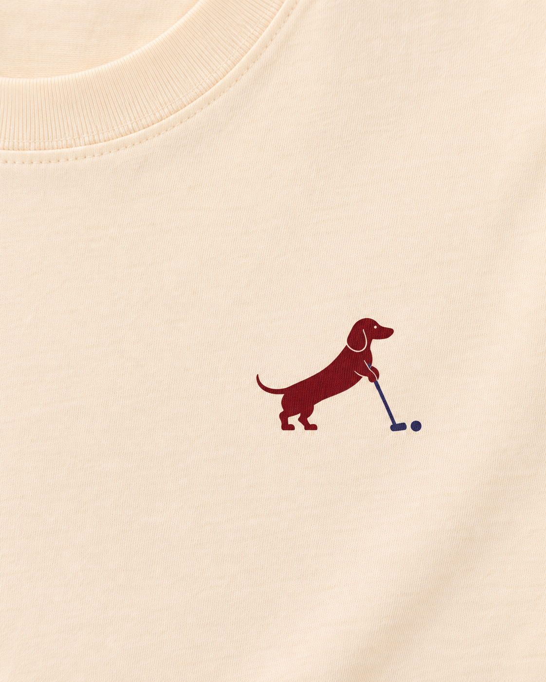 Putting dachshund golf T-shirt print detail. Color: Apricot