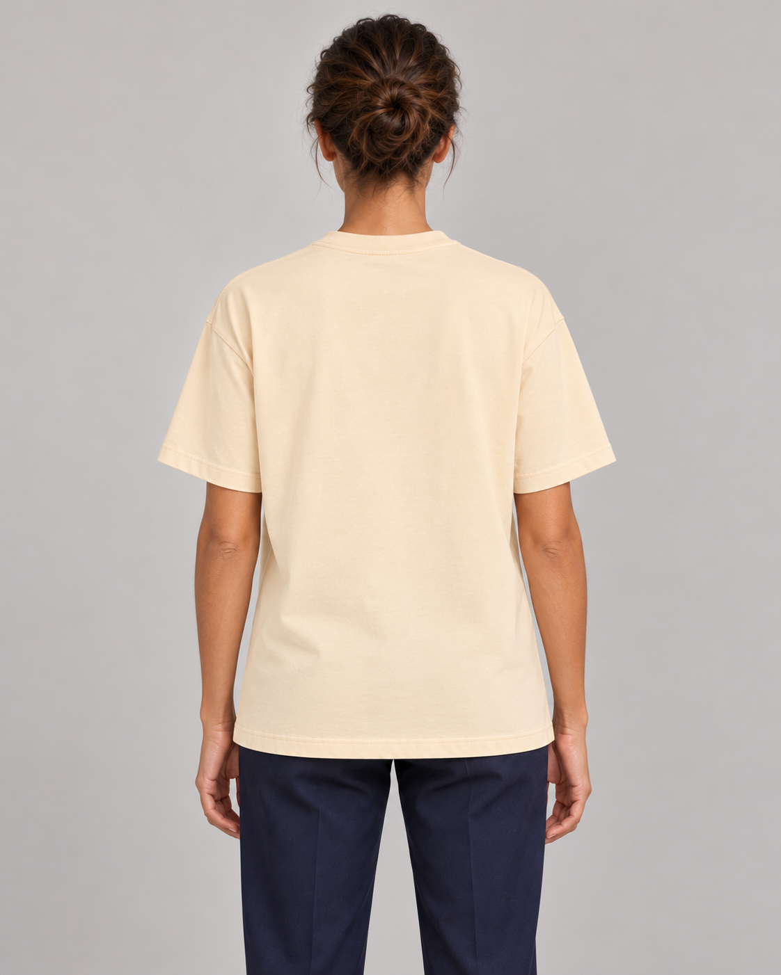 Woman wearing Putting dachshund golf T-shirt, back studio view. Color: Apricot