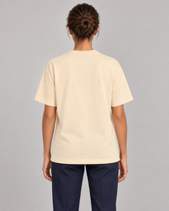 Woman wearing Putting dachshund golf T-shirt, back studio view. Color: Apricot