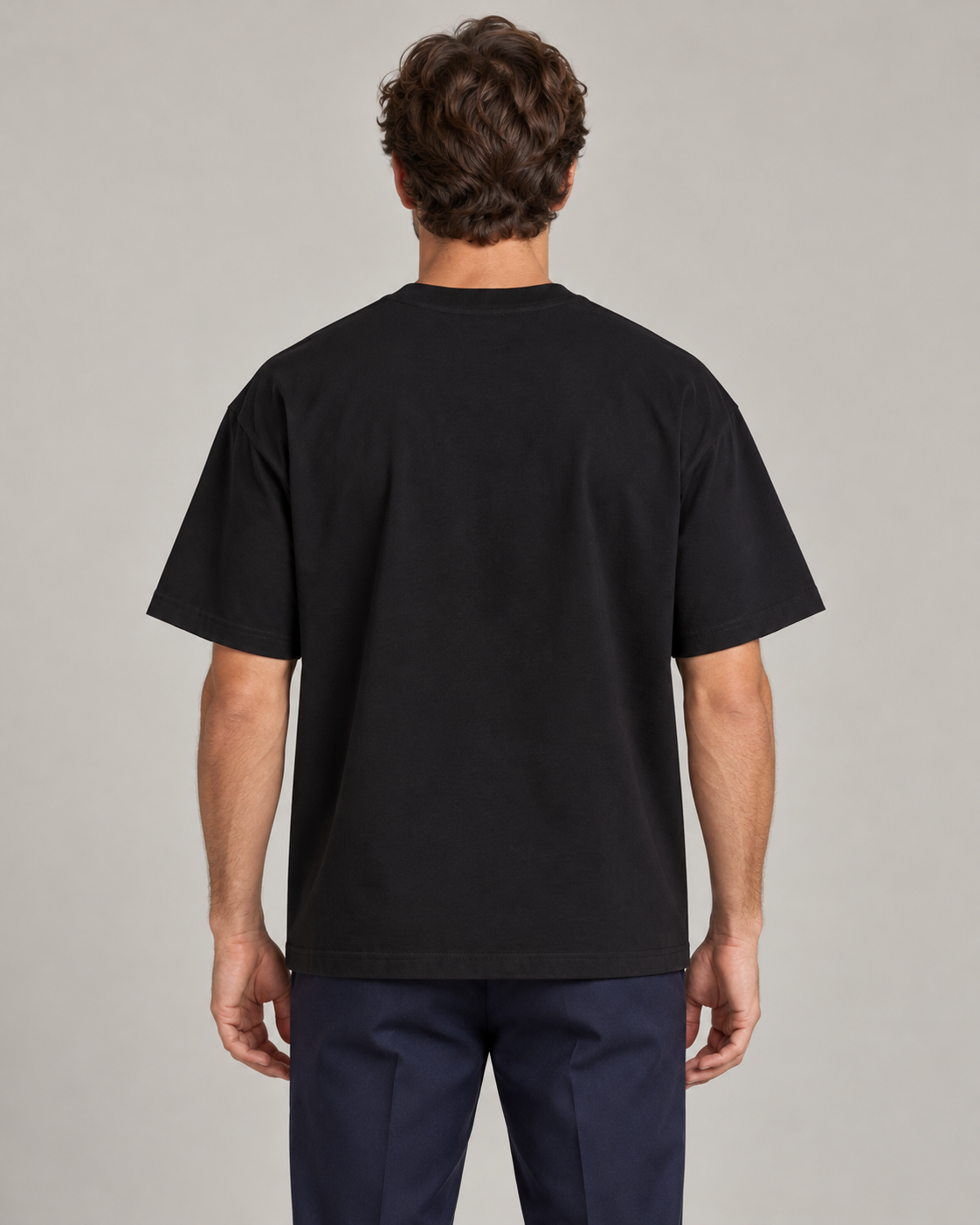 Man wearing Putting dachshund golf T-shirt, back studio view. Color: Black