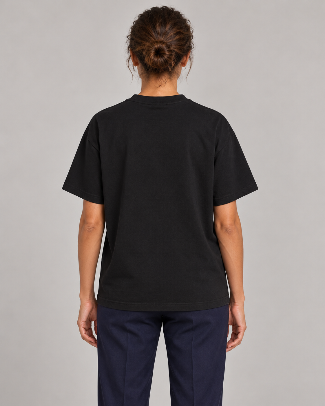 Woman wearing Putting dachshund golf T-shirt, back studio view. Color: Black