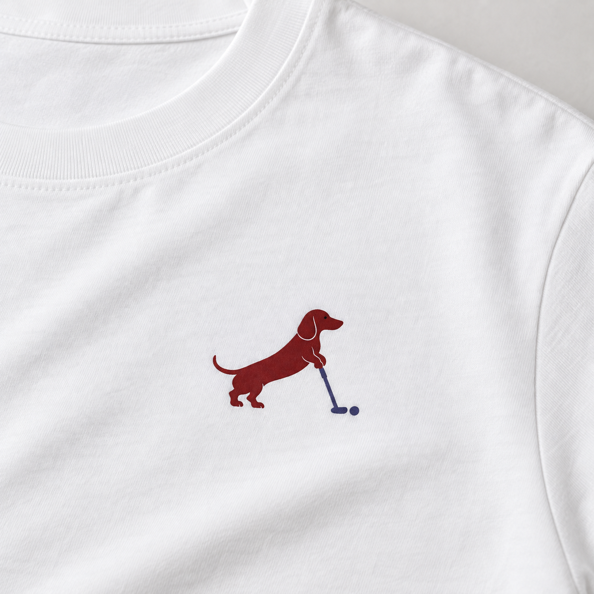 Putting dachshund golf T-shirt print detail. Color: White