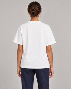 Woman wearing Putting dachshund golf T-shirt, back studio view. Color: White