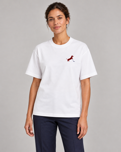 Woman wearing Putting dachshund golf T-shirt, front studio view. Color: White