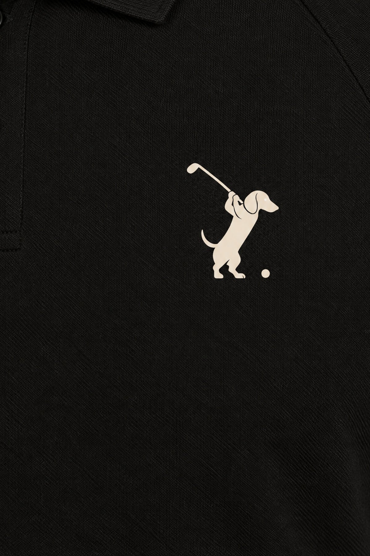 Close-up of the collar and chest logo on the black Swing dachshund golf polo. Color: Black