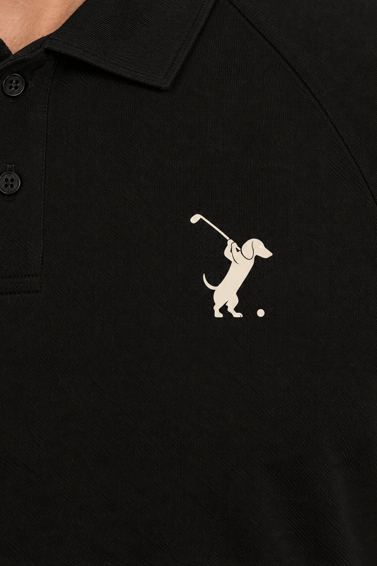 Close-up of the collar and chest logo on the black Swing dachshund golf polo. Color: Black