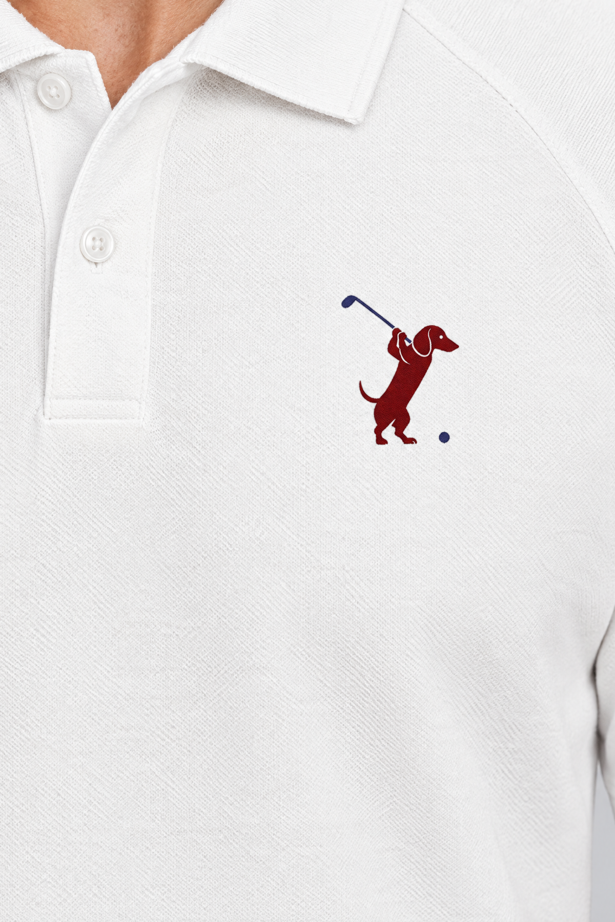 Close-up of the collar and chest logo on the white Swing dachshund golf polo. Color: White