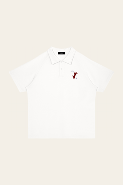 White Swing dachshund golf polo laid flat, front view on warm off-white background. Color: White