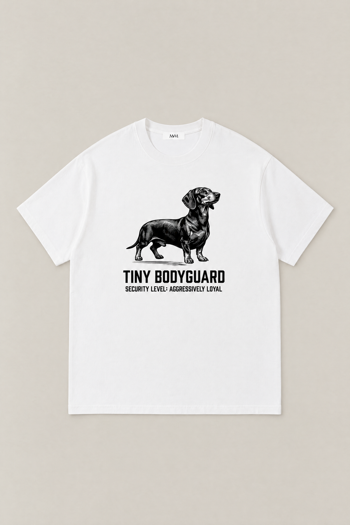 Tiny Bodyguard Dachshund Tee in white, flat lay front view. Color: White