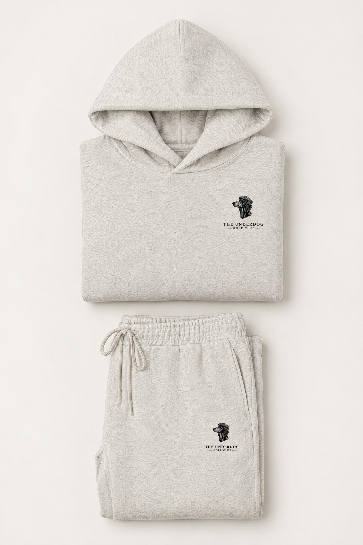 Flat lay of The Long Drive dachshund golf hoodie and matching sweatpants in Oat Gray. Color: Oat Gray