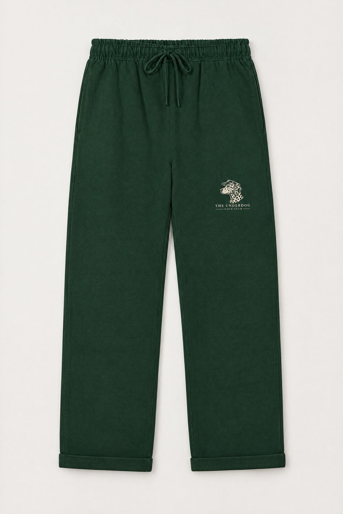 Flat lay of Underdog Golf Club Dalmatian crest sweatpants in Blackish Green. Color: Blackish Green
