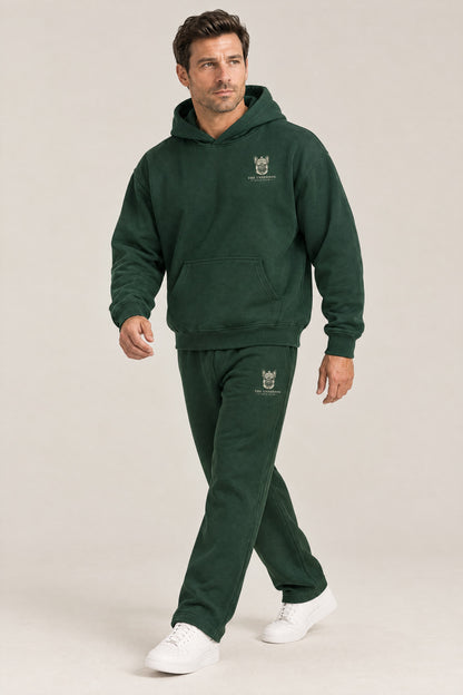 Man walking in The Marshal French Bulldog golf hoodie and sweatpants set in Blackish Green. Color: Blackish Green