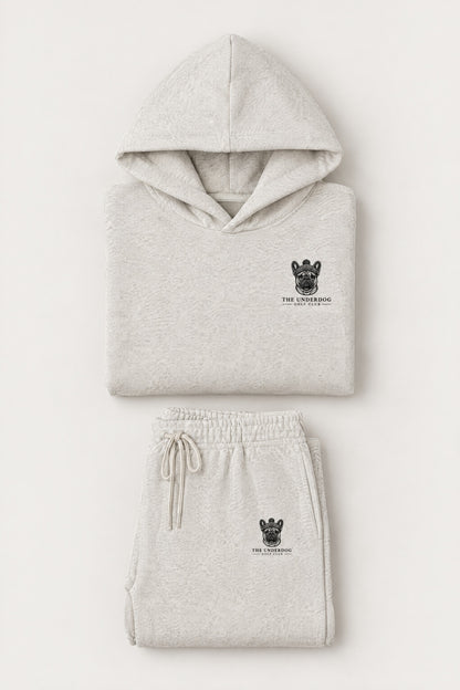 Flat lay of The Marshal French Bulldog golf hoodie and matching sweatpants in Oat Gray. Color: Oat Gray