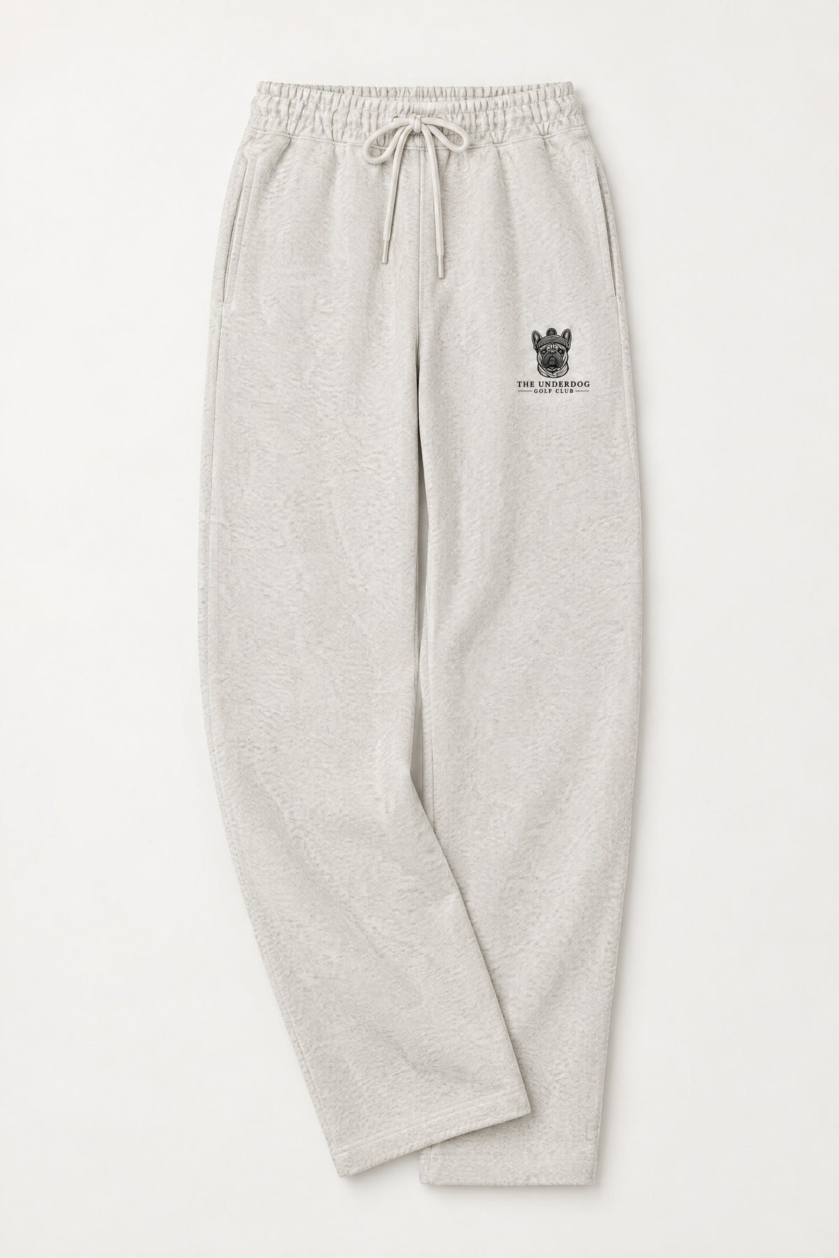 Flat lay of Underdog Golf Club French Bulldog crest sweatpants in Oat Gray. Color: Oat Gray