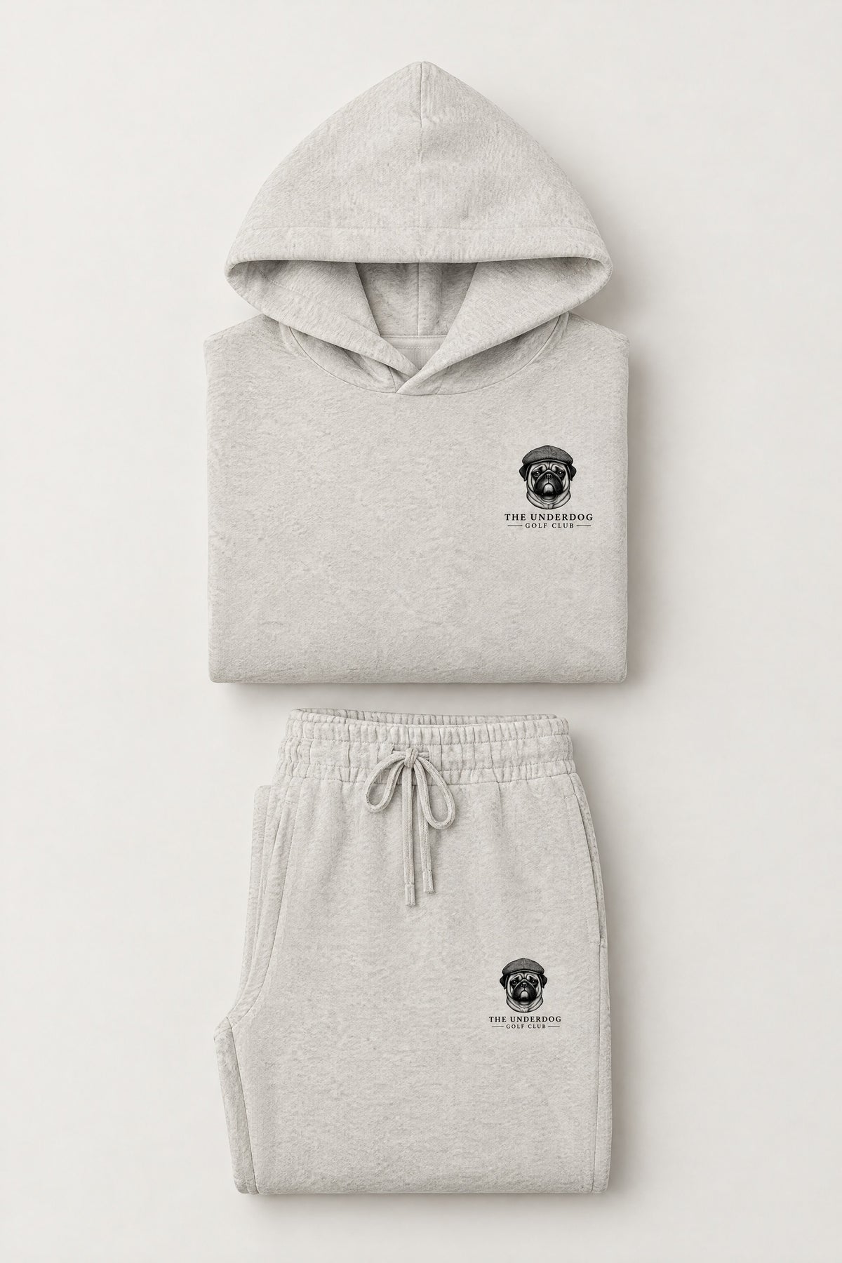 Flat lay of The Heavy Hitter pug golf hoodie and matching sweatpants in Oat Gray. Color: Oat Gray