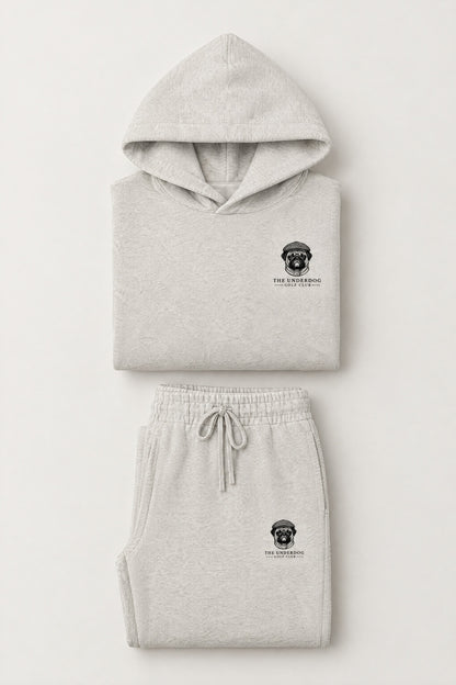 Flat lay of The Heavy Hitter pug golf hoodie and matching sweatpants in Oat Gray. Color: Oat Gray