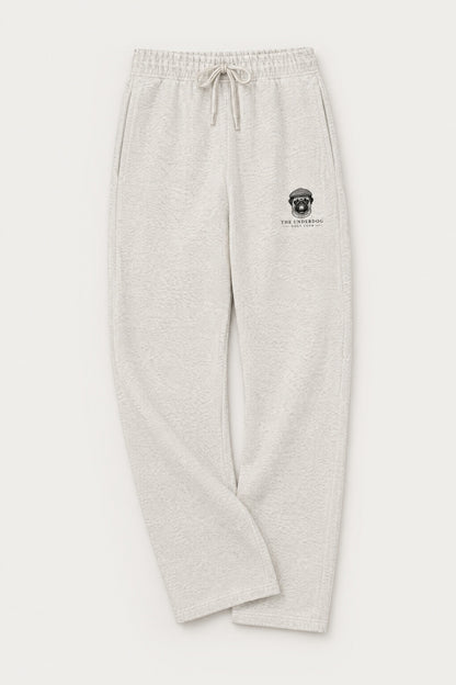Flat lay of Underdog Golf Club pug crest sweatpants in Oat Gray. Color: Oat Gray