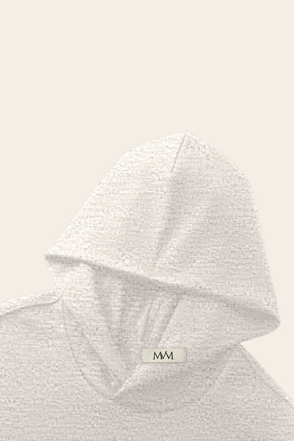 Detail of the hood of the oat gray Underdog Golf Club hoodie with the MVM woven neck label. Color: Oat Gray