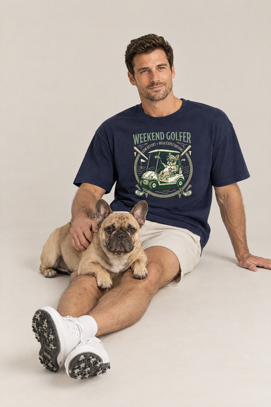 Man sitting on the floor with a French bulldog in the navy Weekend Golfer French Bulldog Golf Tee. Color: Navy