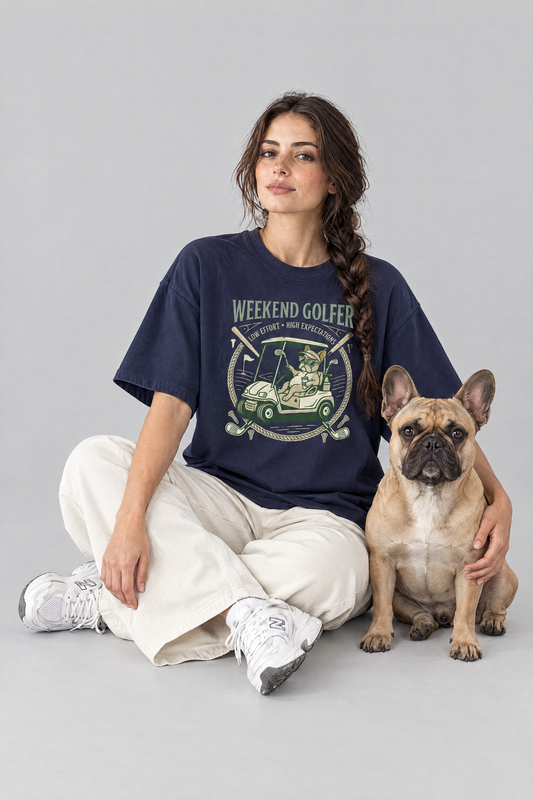Woman sitting on the floor with a French bulldog in the navy Weekend Golfer French Bulldog Golf Tee. Color: Navy
