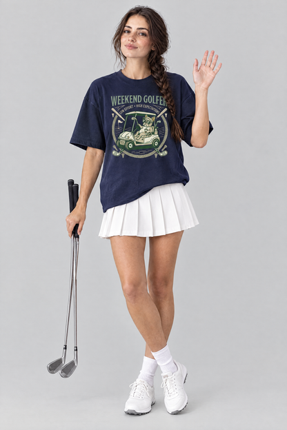 Woman waving and holding golf clubs in the navy Weekend Golfer French Bulldog Golf Tee and a white pleated skirt. Color: Navy